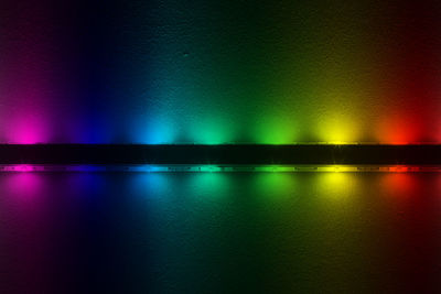 Close-up of colorful illuminated led on wall