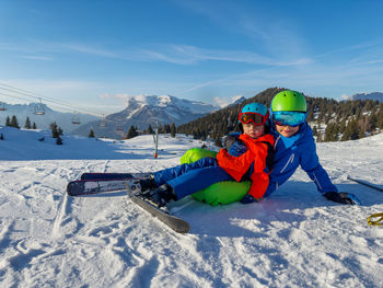 Rear view of man skiing on snow