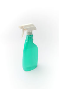 Close-up of plastic bottle against white background