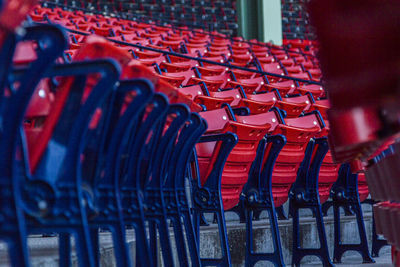 Rear view of red chairs in rows