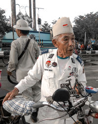 Man with umbrella on road