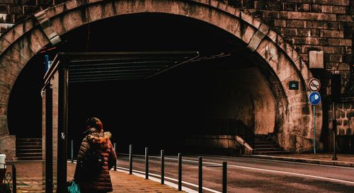 Man standing by railing