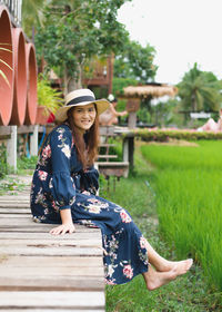 Full length of woman sitting in park