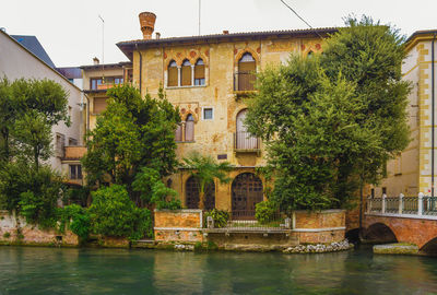 Building by river in town