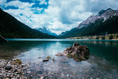 Scenic view of lake and mountains against sky