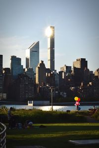 Gantry plaza state park by east river against modern buildings in city