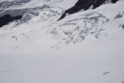 Scenic view of snow covered mountains against sky