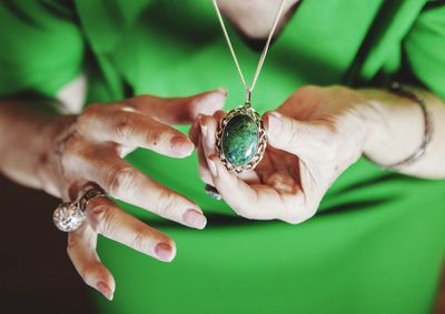 Close-up of woman hand holding leaf