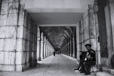 Man sitting in corridor