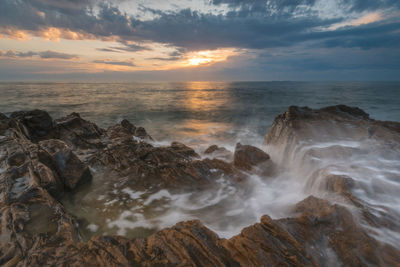 Scenic view of sea against sky during sunset