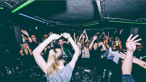 Young woman in dark room