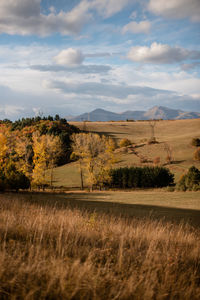 Scenic view of autumn landscape of mountains against the sky