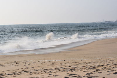 Scenic view of beach against clear sky