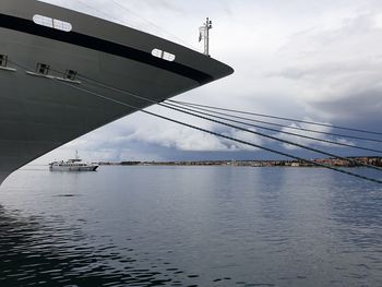 Low angle view of bridge over sea against sky