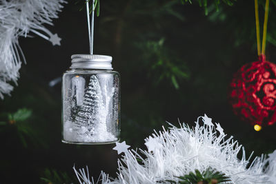 Close-up of small glass in jar on table