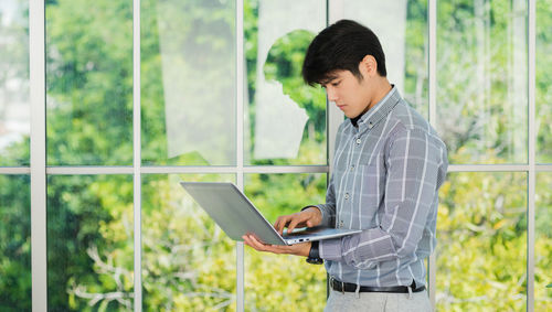 Young man using digital tablet