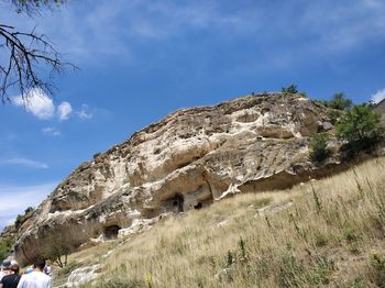 Low angle view of rock formations against sky