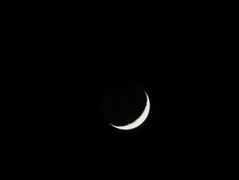 Low angle view of moon against sky at night