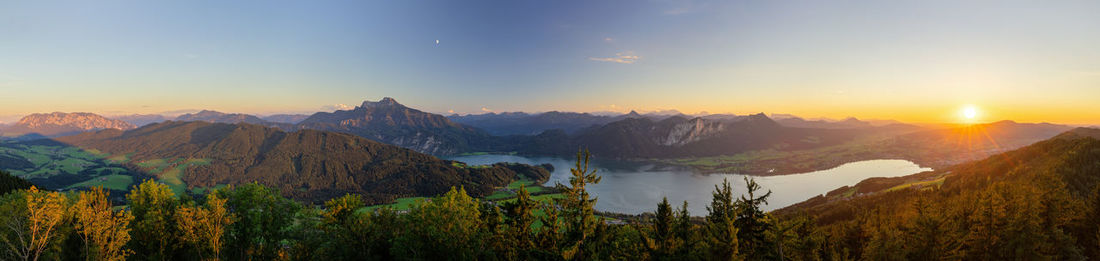 Scenic  view of mountains lake mondsee  against sky during sunset