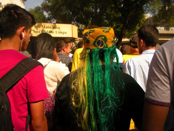 Rear view of people on street in city