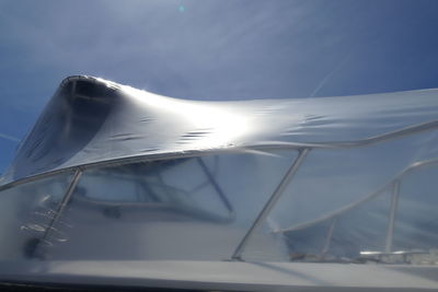 Close-up of car against sky