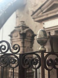 Close-up of metal railing against building