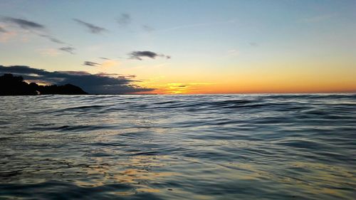 Scenic view of sea at sunset