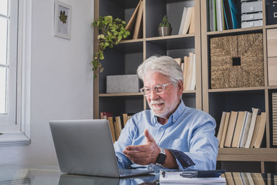 Man sitting on table at home