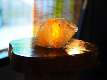 Close-up of orange slice on table