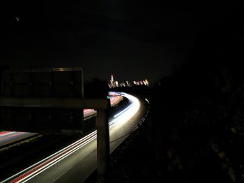 High angle view of light trails on road in city