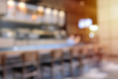 Defocused image of illuminated restaurant