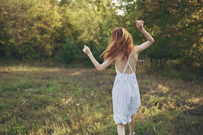 Full length of woman standing on field