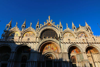 Low angle view of cathedral against blue sky