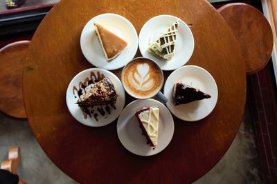 Directly above shot of cakes and coffee on table