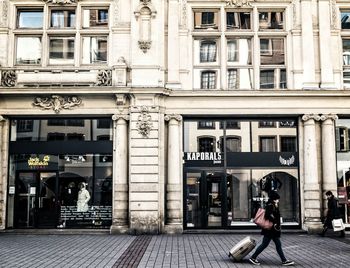 Woman in front of building