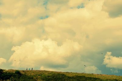 Scenic view of landscape against cloudy sky