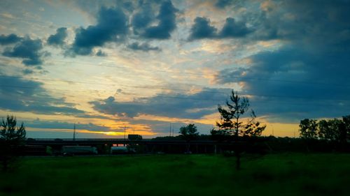 Scenic view of landscape against cloudy sky