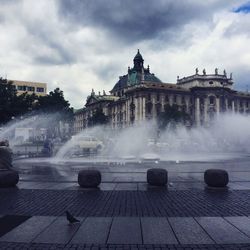 Fountain with buildings in background