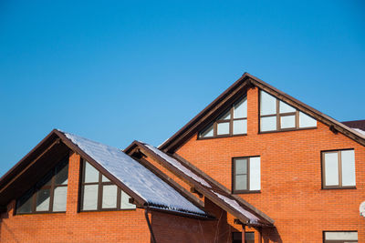 House against clear blue sky