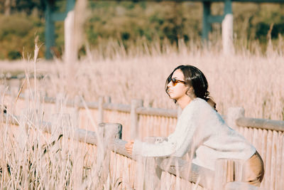 Young woman standing on field