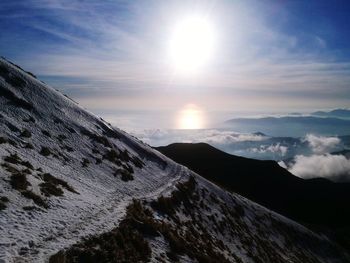 Scenic view of mountains against sky during sunset