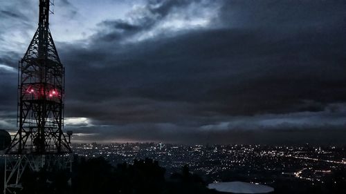 Panoramic view of cityscape against sky at night