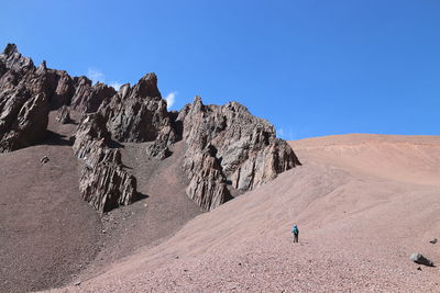 Scenic view of rocky mountains against clear blue sky