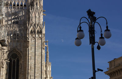 Low angle view of street light against sky