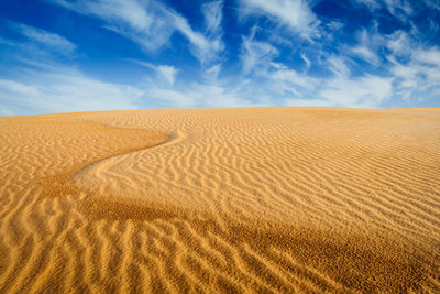 Scenic view of desert against sky