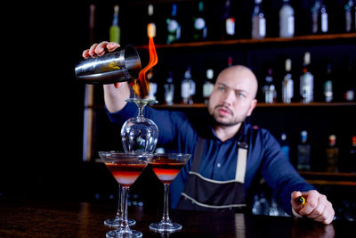 Portrait of man with wineglass on table