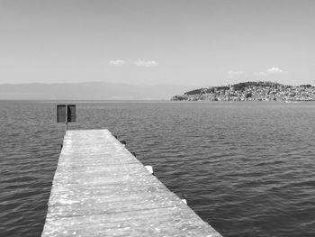 Pier over sea against sky