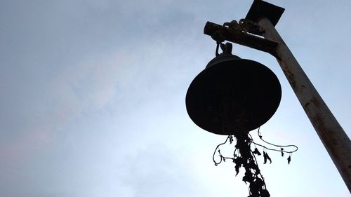 Low angle view of hanging against sky