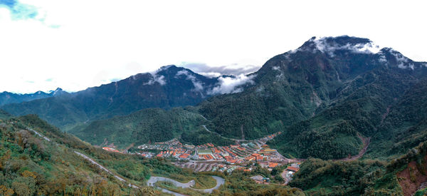 High angle shot of townscape against mountain range