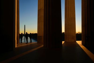 Silhouette of people at sunset